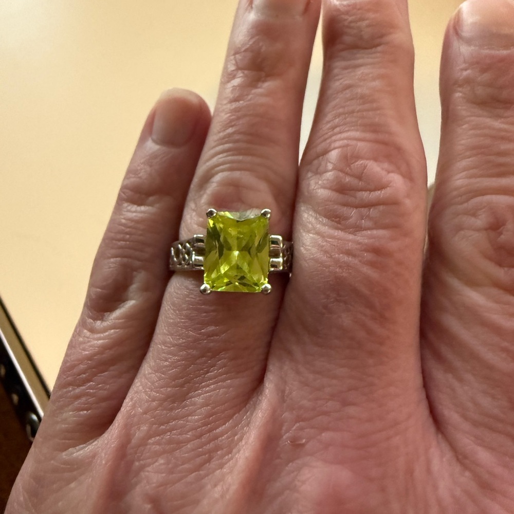 Lia Sophia rhodium finish ring with a pale green crystal